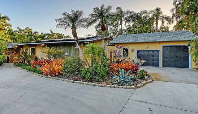 Casa de Flores is an updated, charming, old Florida rambler w/salt water pool. in Sarasota