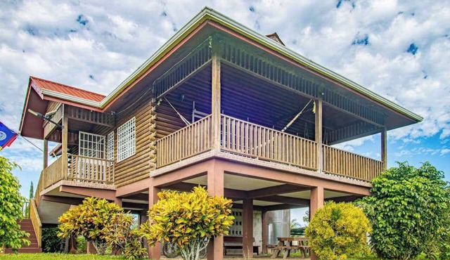 Charming cabin with private balcony, lush views & eco-friendly features