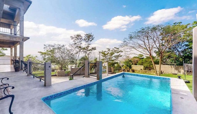 Enchanting home with pool, volleyball, mountain/city views & AC