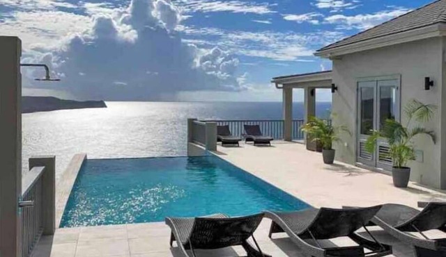 Luxury and tranquility in a 5 suite villa with 280 degree ocean views in English Harbour