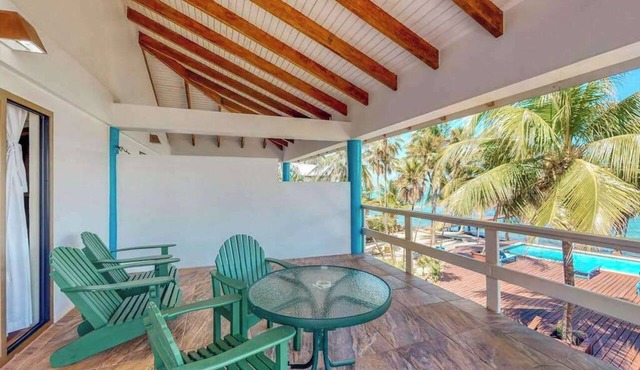 Ocean view condo at beachfront complex with AC, free WiFi, & pool
