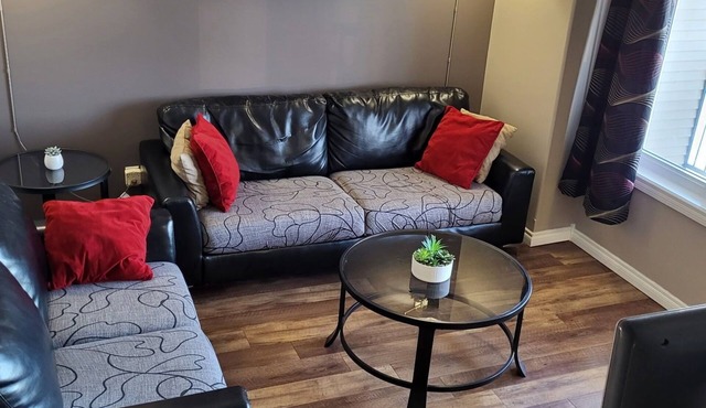 Spacious 4-bedroom townhome in charming Red Deer with WiFi, AC in Red Deer