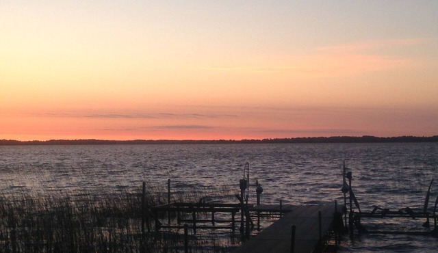 Spectacular sunrise glistening off the lake from this quiet lakeside retreat in Dent