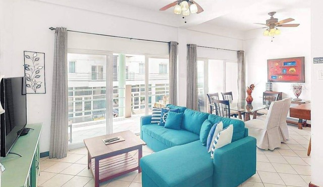 Stylish condo near the beach with pool, fast WiFi, partial ocean views & AC