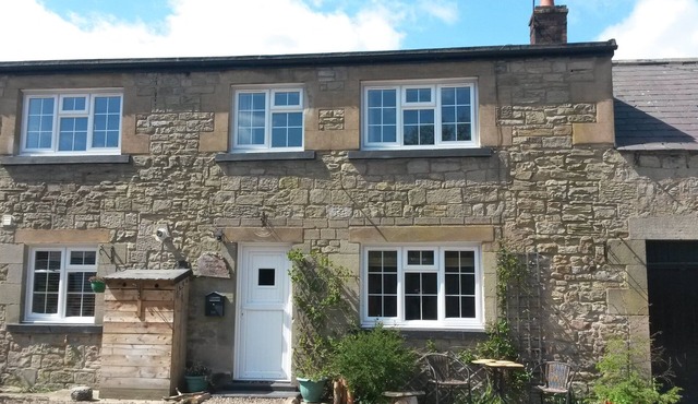 'The Stables'. A lovely stone built cottage in the small village of Powburn. in Powburn