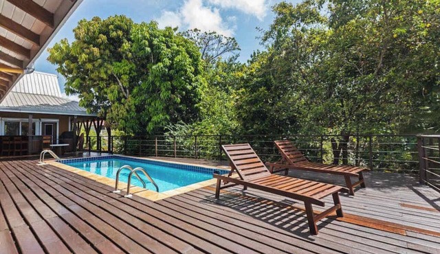 Tropical beachfront getaway with private pool, ocean views & enclosed yard