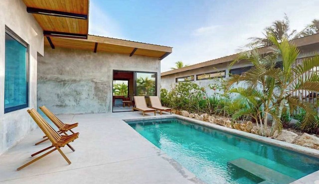 Waterfront villa with pool, spacious deck, dog-friendly & office space
