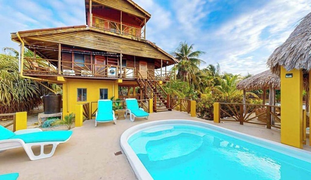 Waterfront villa with private pool, balcony, partial AC, fast WiFi - near beach