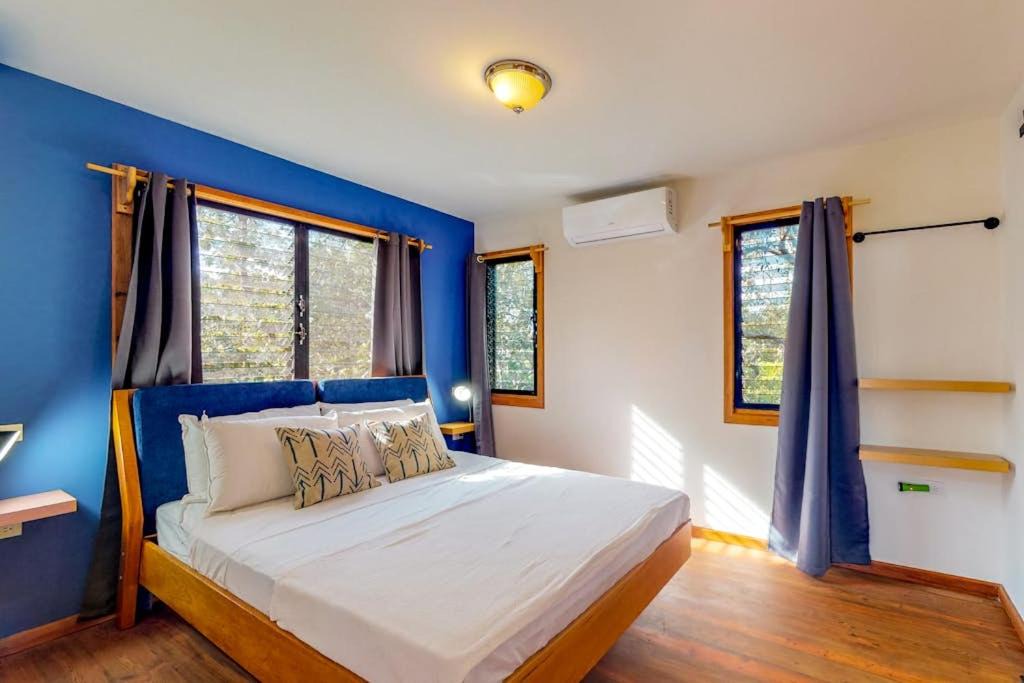 Surfside House | Three forest cabanas with verandas hammocks WiFi & partial AC - walk to beach