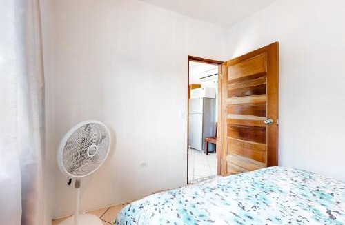 Caye Caulker Apartment | Charming Suite with WiFi AC Shared Pool Grill Area & Rooftop Deck