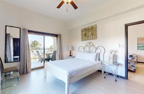 San Pedro House | Serene oceanfront condo with shared pool ocean view WiFi & partial AC