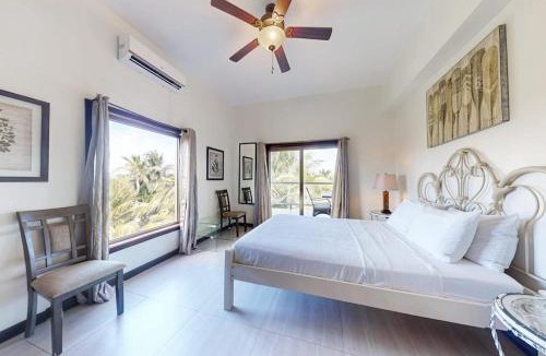 San Pedro House | Serene oceanfront condo with shared pool ocean view WiFi & partial AC