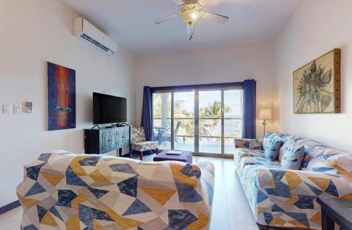 San Pedro House | Serene oceanfront condo with shared pool ocean view WiFi & partial AC