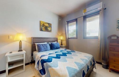 San Pedro House | Beachfront condo with balcony sea view partial AC pool dock & kayaks