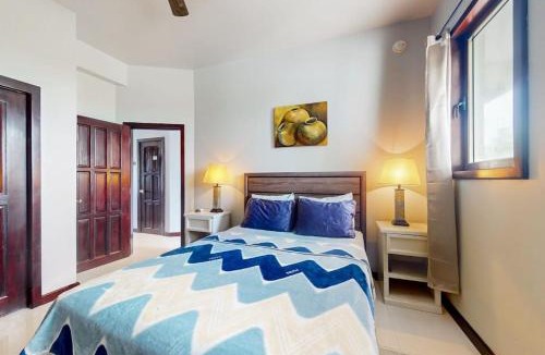 San Pedro House | Beachfront condo with balcony sea view partial AC pool dock & kayaks