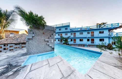 Caye Caulker Apartment | Cozy Suite for Two with WiFi AC Shared Pool Grill & Sunsets from the Rooftop