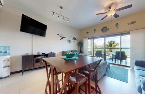 San Pedro House | Oceanfront condo with pool gorgeous ocean views WiFi & partial AC