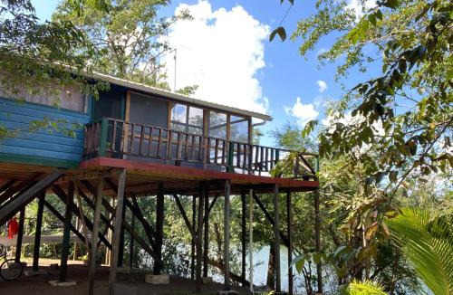 Burrell Boom House | Amazing Jungle Tree House right over the river with bikes and canoe