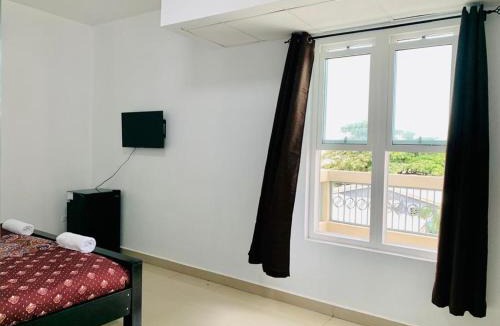 San Pedro Hotel | Coastal Bay Suite & Golf Cart Rental